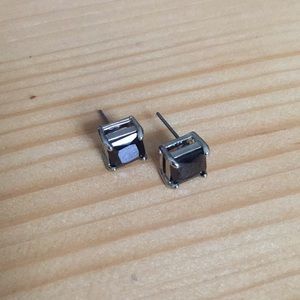 Silver and black square earrings.